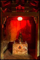 Monkey altar lit by lantern, Japanese Bridge. Hoi An, Vietnam ( color)