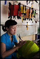 Woman working on paper lantern. Hoi An, Vietnam (color)