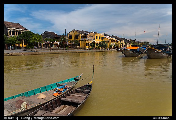 Boats, Thu Bon River, and houses. Hoi An, Vietnam