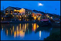 Moonrise over houses and river. Hoi An, Vietnam (color)