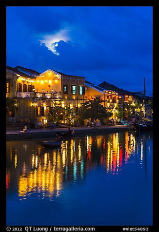 Ancient townhouses and moon reflected in river. Hoi An, Vietnam