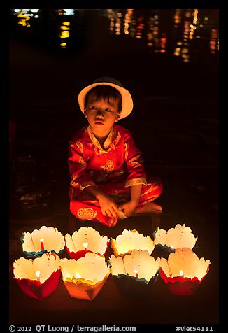 Boy with candle lanterns for sale. Hoi An, Vietnam