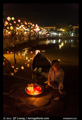 Woman selling candle lanterns by the bridge. Hoi An, Vietnam (color)