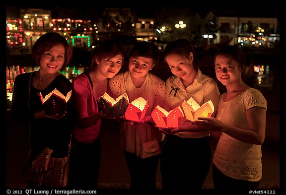 Group of women holding candles. Hoi An, Vietnam