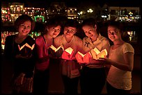 Group of women holding candles. Hoi An, Vietnam ( color)