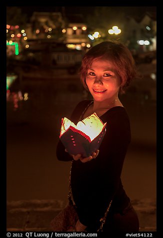 Young woman with candle box. Hoi An, Vietnam