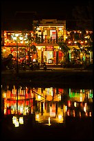 Waterfront house reflected in river at night. Hoi An, Vietnam ( color)