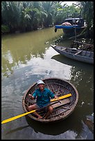 Man in circular boat near Cam Kim Village. Hoi An, Vietnam (color)