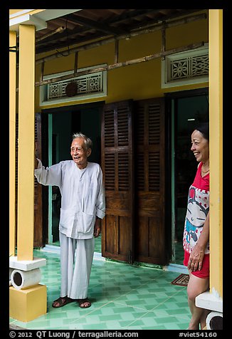 Woman and elder on porch of their house, Cam Kim Village. Hoi An, Vietnam