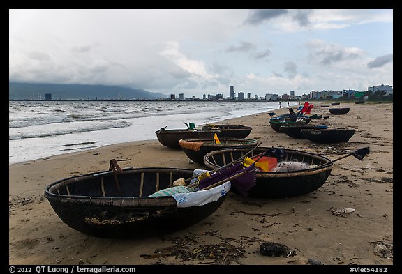 Coracle boats and city skyline. Da Nang, Vietnam