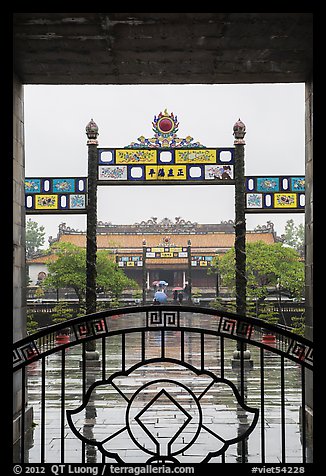 Palace of Supreme Peace viewed from gate in the rain. Hue, Vietnam (color)