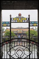 Palace of Supreme Peace viewed from gate in the rain. Hue, Vietnam (color)