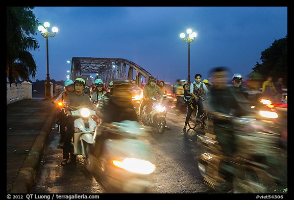 Night motorcyle traffic out of Trang Tien bridge. Hue, Vietnam