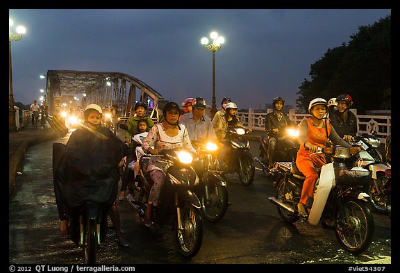 Mtorcylists by night, Trang Tien Bridge. Hue, Vietnam