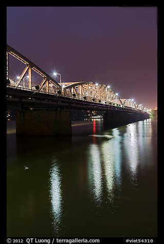 Trang Tien Bridge lights reflected in Perfume River. Hue, Vietnam