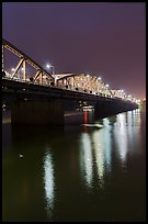 Trang Tien Bridge lights reflected in Perfume River. Hue, Vietnam (color)