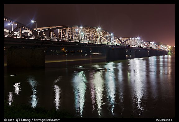 Eiffel-designed Trang Tien Bridge at night. Hue, Vietnam