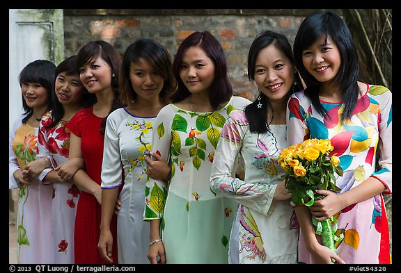 Row of women in Ao Dai, Temple of the Litterature. Hanoi, Vietnam (color)