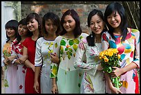 Row of women in Ao Dai, Temple of the Litterature. Hanoi, Vietnam ( color)