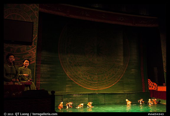 Musicians and water puppets during performance, Thang Long Theatre. Hanoi, Vietnam