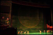 Musicians and water puppets during performance, Thang Long Theatre. Hanoi, Vietnam (color)
