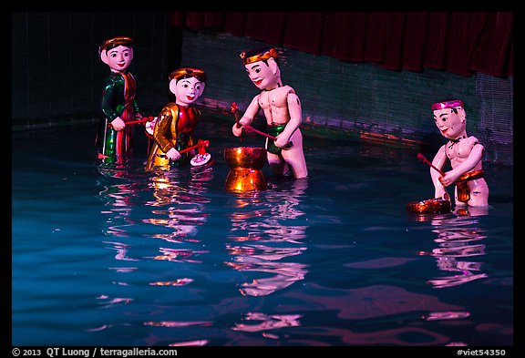 Water puppets (4 characters with musical instruments), Thang Long Theatre. Hanoi, Vietnam