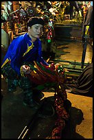 Water puppet artist holding dragon backstage, Thang Long Theatre. Hanoi, Vietnam ( color)