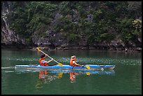 Sea kayakers on emerald waters. Halong Bay, Vietnam (color)