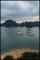 Elevated view of beach, boats and karst from Titov Island. Halong Bay, Vietnam (color)