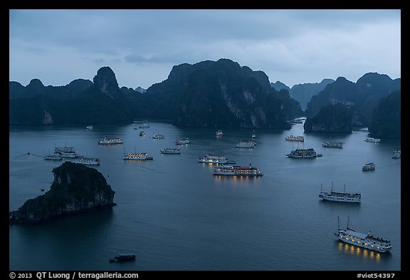 Moored boats and islands from above at dusk. Halong Bay, Vietnam