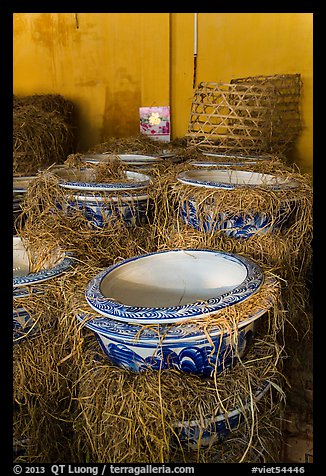 Ceramic vases wrapped in hay in storeroom. Bat Trang, Vietnam (color)