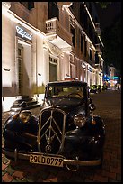 Vintage car in front of Metropole hotel at night. Hanoi, Vietnam ( color)