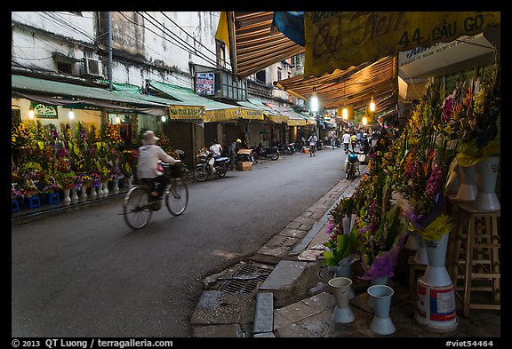 Street with flower sellers in early morning, old quarter. Hanoi, Vietnam