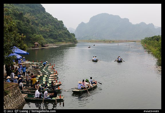 Groups leaving wharf on boats, Trang An. Ninh Binh,  Vietnam