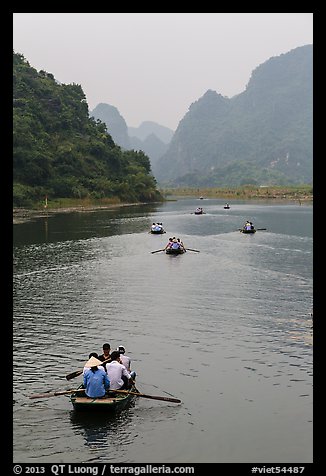 Boats in karstic lanscape of steep cliffs, Trang An. Ninh Binh,  Vietnam