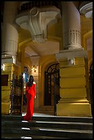 Woman in evening gown entering opera house. Hanoi, Vietnam ( color)