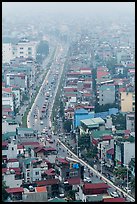 Expressway and buildings in mist seen from above. Hanoi, Vietnam (color)