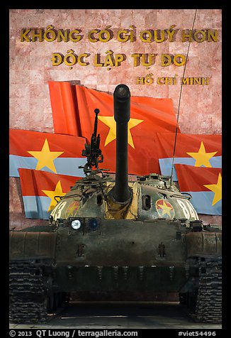 Tank, Vietcong flags, and Ho Chi Minh quote. Hanoi, Vietnam