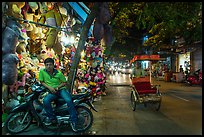 Street at night with motorcycle and cyclo, old quarter. Hanoi, Vietnam ( color)