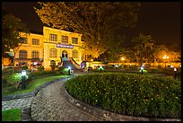 Public garden and French-area building at night. Hanoi, Vietnam ( color)