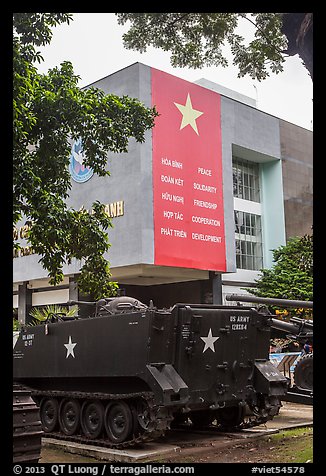 Tanks and signs extolling peace, War Remnants Museum, district 3. Ho Chi Minh City, Vietnam (color)