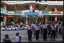 Schoolchildren in school courtyard, district 5. Ho Chi Minh City, Vietnam (color)