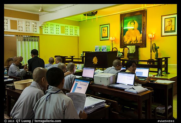 Monks working on computers, An Quang Pagoda, district 10. Ho Chi Minh City, Vietnam