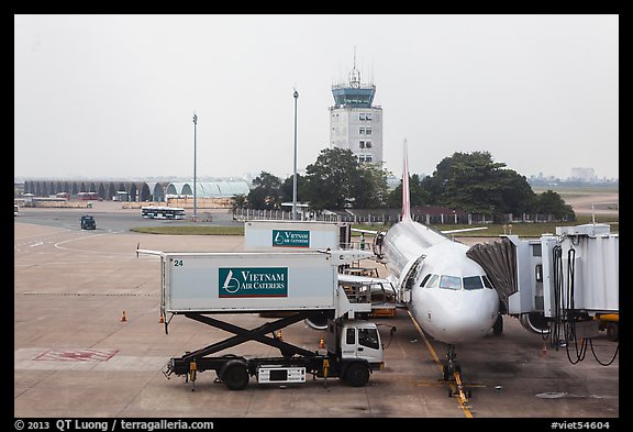 Airliner and control tower, Tan Son Nhat airport, Tan Binh district. Ho Chi Minh City, Vietnam