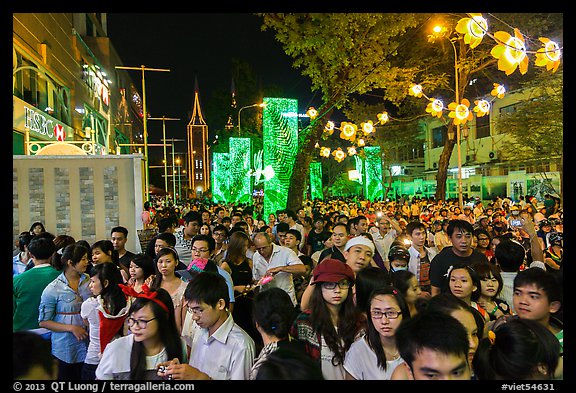 Street filled with crowds on Christmas eve. Ho Chi Minh City, Vietnam (color)