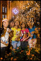 Young Revellers in front of Notre Dame Cathedral on Christmas Eve. Ho Chi Minh City, Vietnam (color)