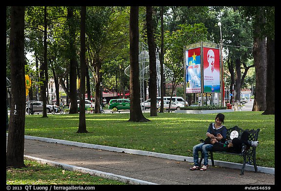 Relaxing on a public bench in April 30 Park. Ho Chi Minh City, Vietnam (color)