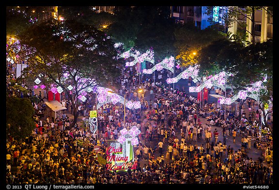 Le Loi boulevard with decorations and crowds from above. Ho Chi Minh City, Vietnam