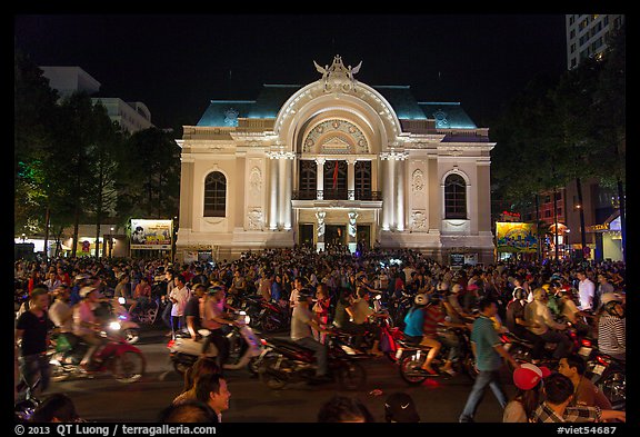 Crowds in front of Opera House at night. Ho Chi Minh City, Vietnam