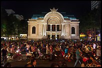 Crowds in front of Opera House at night. Ho Chi Minh City, Vietnam (color)